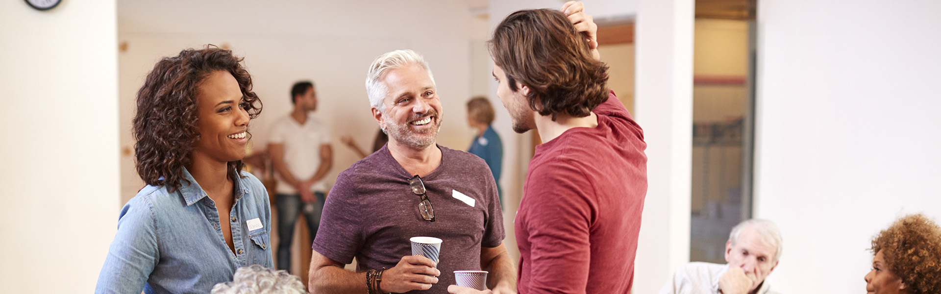 Group of people networking at a village hall
