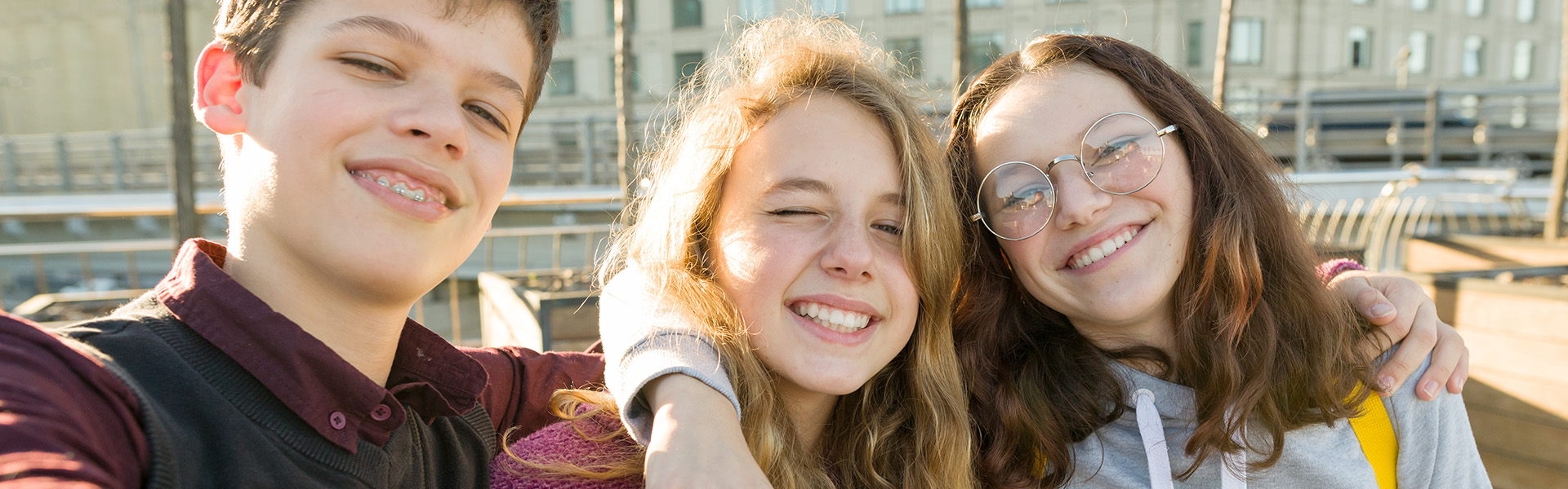 Three teens smiling together