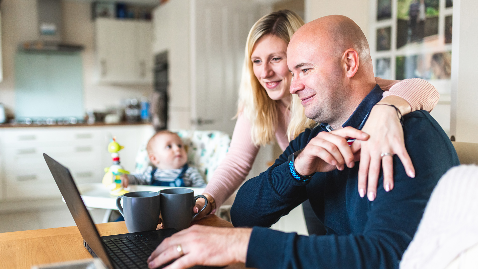 Couple working from home with baby nearby